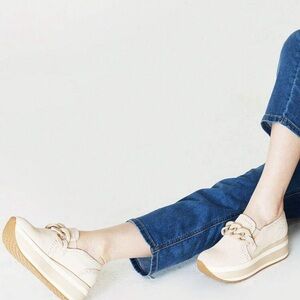 NWT Women’s platform loafers tan color with white stripe on sole of shoe.